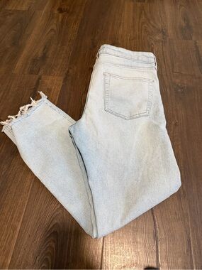 Men’s 32 light wash, distressed hem jeans